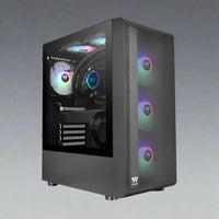 A gaming PC with a black case and RGB lighting, featuring a transparent side panel showing the internal components including the CPU, motherboard, graphics card, cooling system, and RAM.